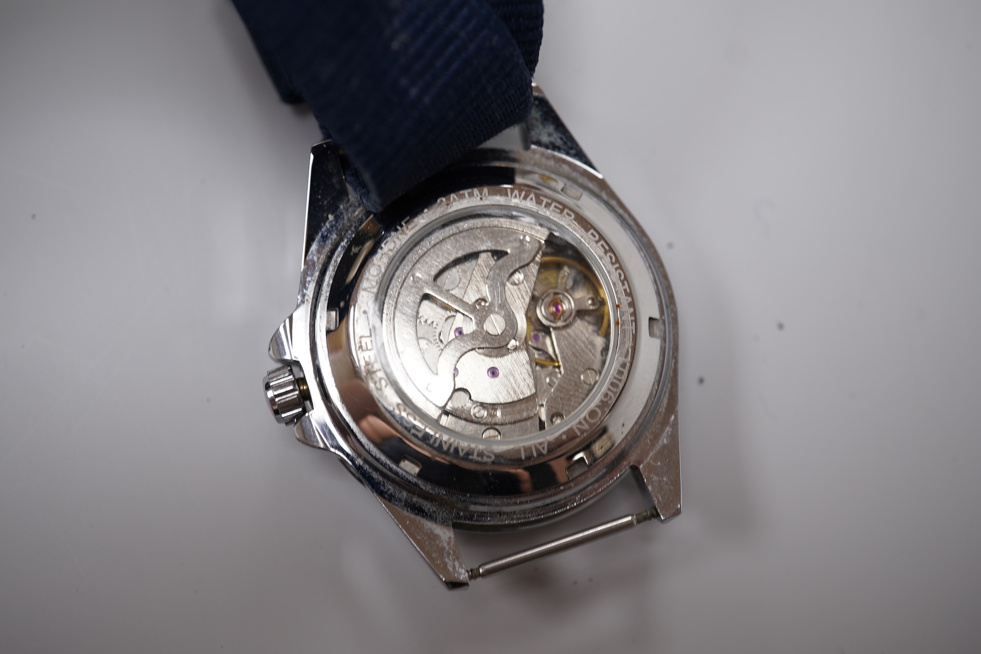 Four assorted gentleman's recent wrist watches including gilt stainless steel Rotary with visible escapement, Sekonda and Seiko.